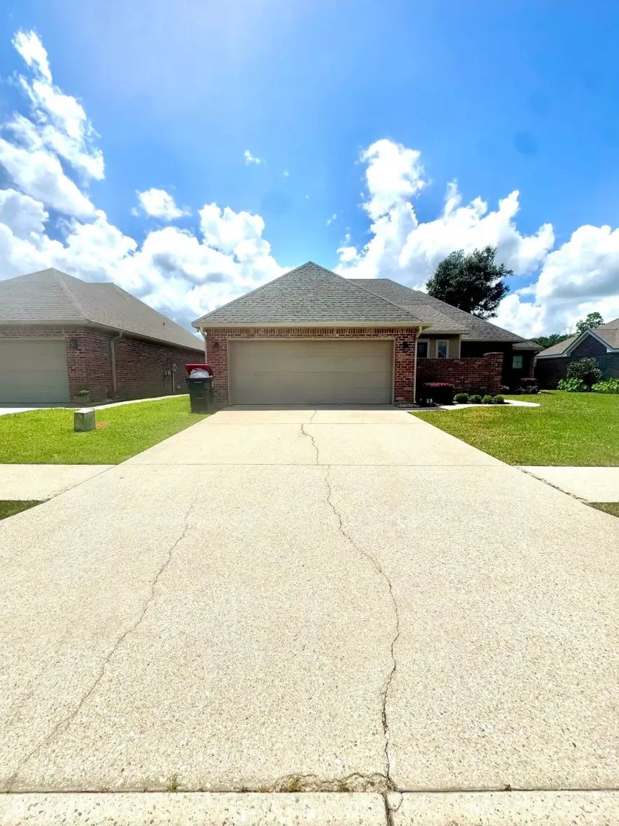 Concrete driveway — dirt & mildew washed out — after